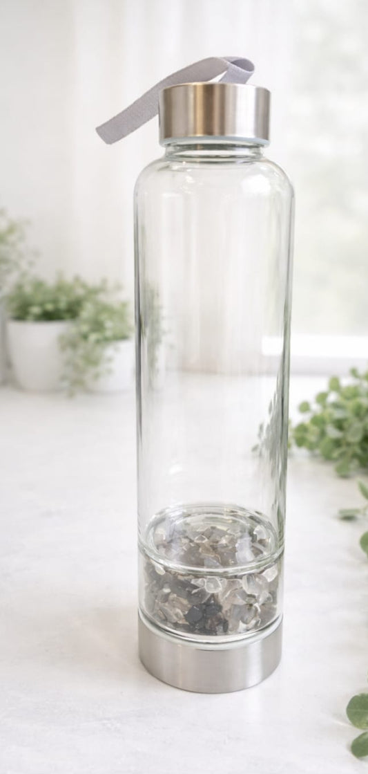 Botella de cristal , con cuarzo blanco, ahumado ,turmalina